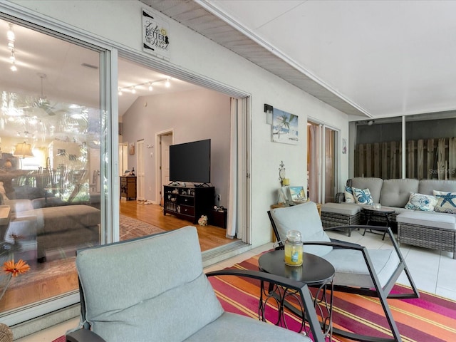 living room featuring vaulted ceiling