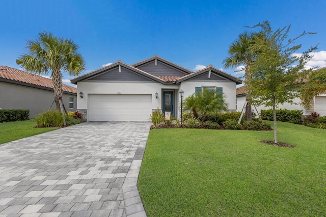 view of front of house with a garage and a front yard