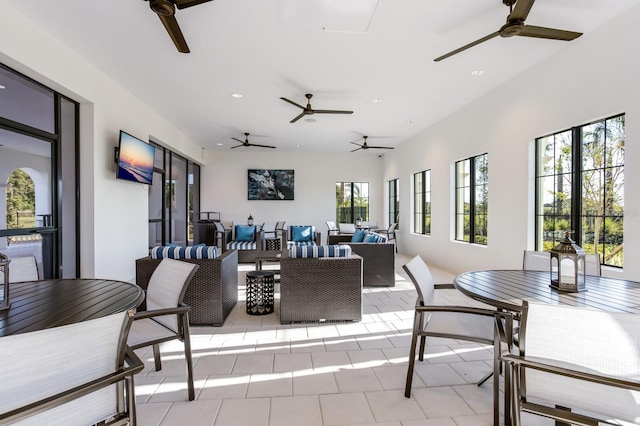 dining space with ceiling fan and a healthy amount of sunlight