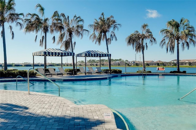 pool with a patio area and a gazebo