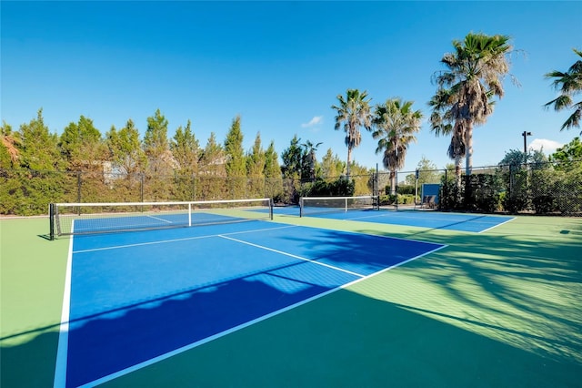 view of sport court with basketball hoop