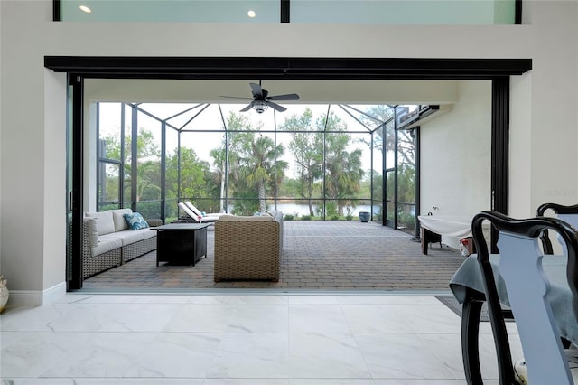 view of patio with an outdoor living space and a lanai