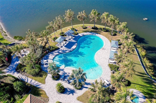 view of swimming pool featuring a water view