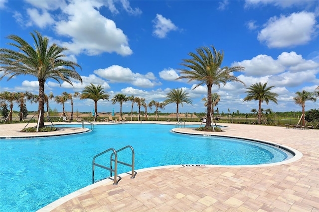 view of pool featuring a patio area