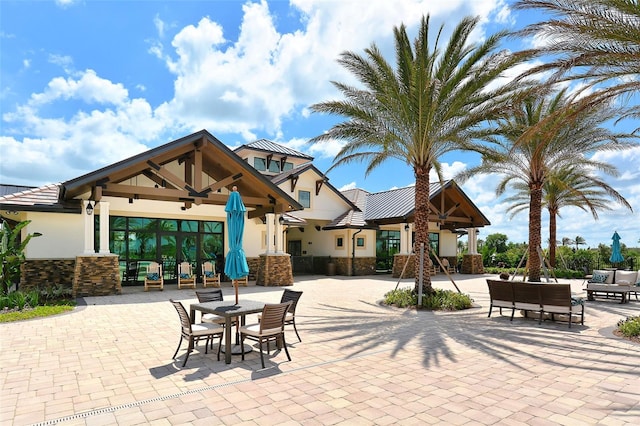 view of patio featuring ceiling fan, outdoor lounge area, and french doors