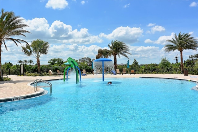 view of pool with pool water feature