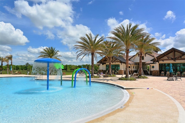 view of pool with pool water feature