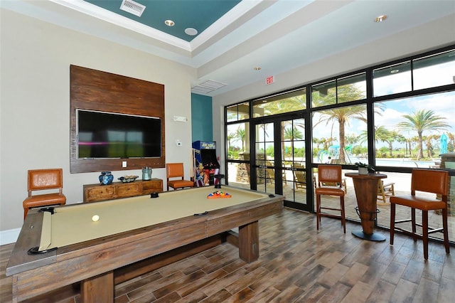 playroom featuring ornamental molding, pool table, a raised ceiling, and hardwood / wood-style floors