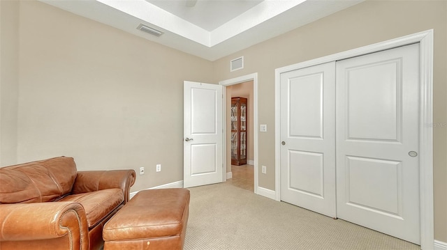 sitting room with light colored carpet