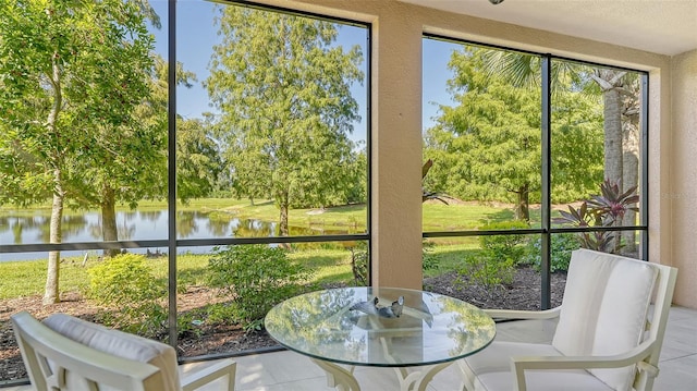 sunroom / solarium with a water view