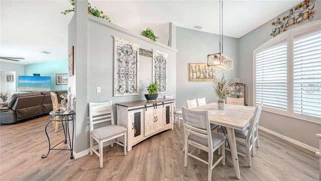 dining room featuring light hardwood / wood-style flooring and ceiling fan