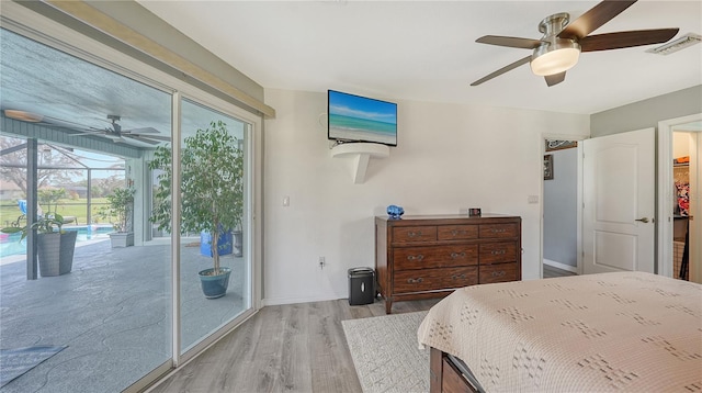 bedroom with light hardwood / wood-style flooring, access to exterior, and ceiling fan