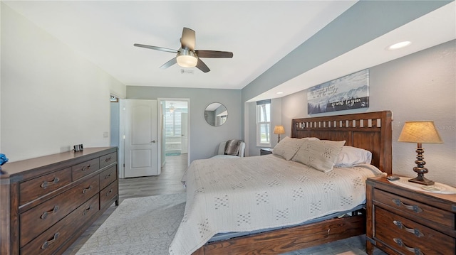 bedroom with ceiling fan and hardwood / wood-style floors