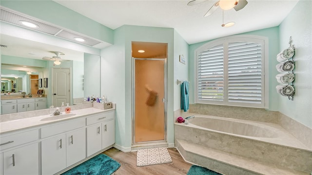 bathroom with vanity, wood-type flooring, separate shower and tub, and ceiling fan