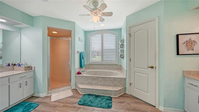 bathroom with vanity, hardwood / wood-style floors, shower with separate bathtub, and ceiling fan