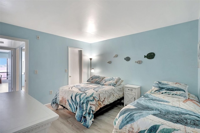 bedroom with light hardwood / wood-style floors