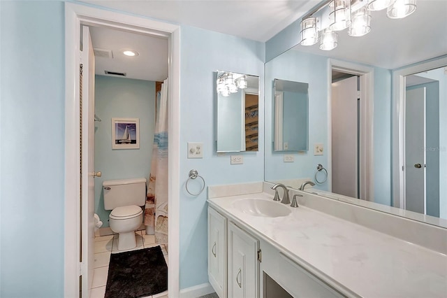 bathroom featuring tile patterned floors, walk in shower, vanity, and toilet