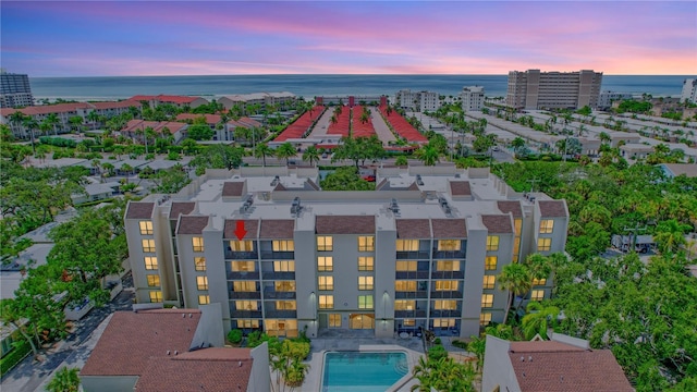 aerial view at dusk with a water view