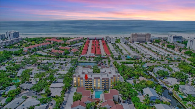 aerial view at dusk with a water view