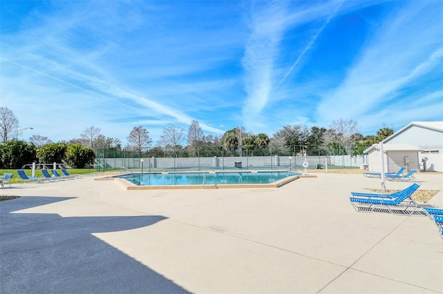 view of swimming pool with a patio area