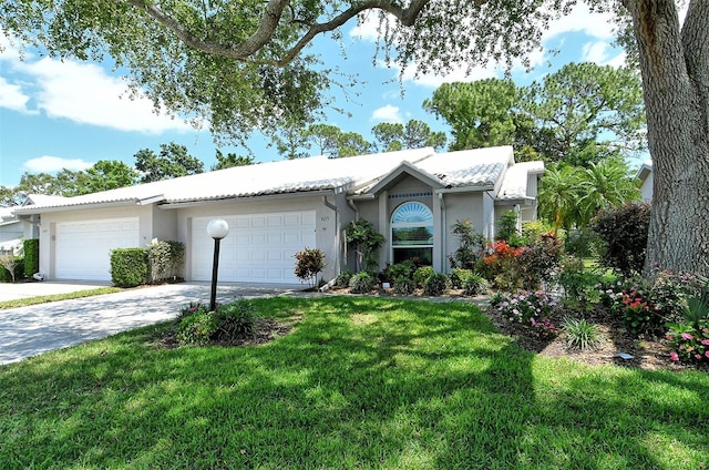 single story home with a front yard and a garage