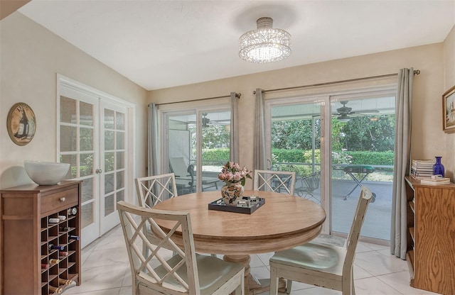 dining area featuring a wealth of natural light and a chandelier