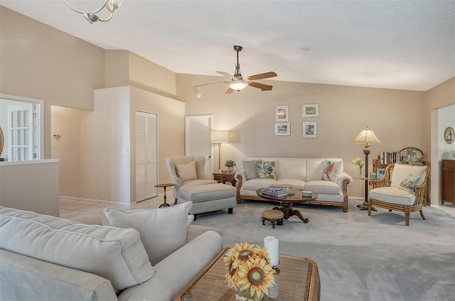 carpeted living room with a textured ceiling, ceiling fan, and vaulted ceiling