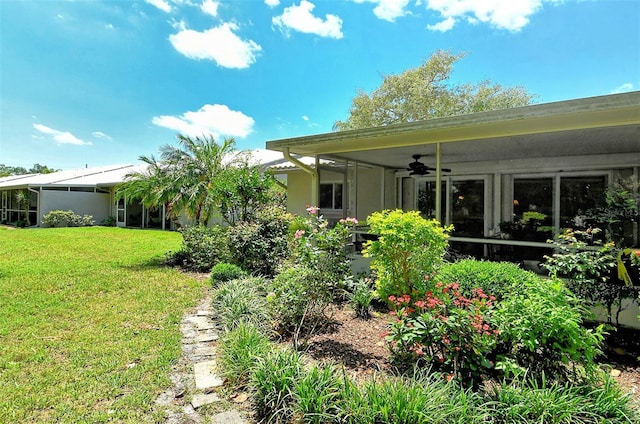 view of yard with ceiling fan