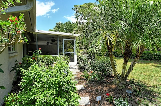 view of yard with ceiling fan