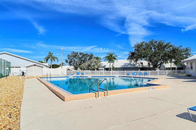 view of swimming pool with a patio