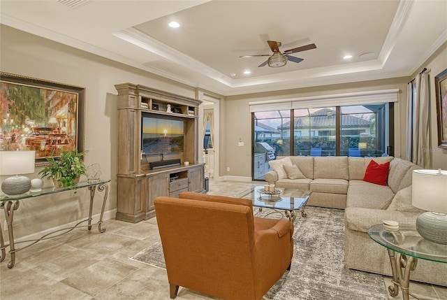 living room featuring crown molding, a tray ceiling, and ceiling fan