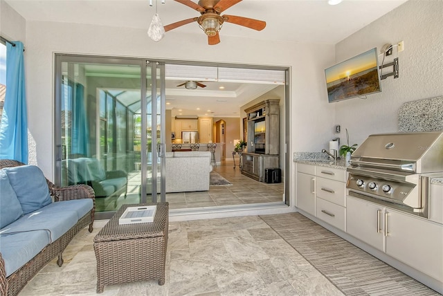 view of patio / terrace featuring grilling area, area for grilling, and ceiling fan