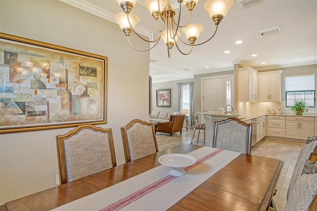 dining room with a chandelier, light tile patterned floors, and crown molding