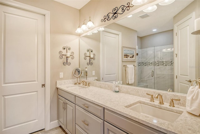 bathroom with vanity and a shower with shower door