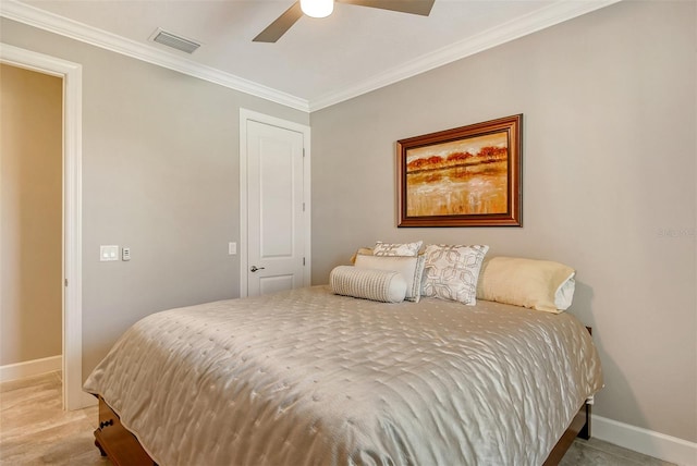 bedroom with light hardwood / wood-style floors, ceiling fan, and crown molding