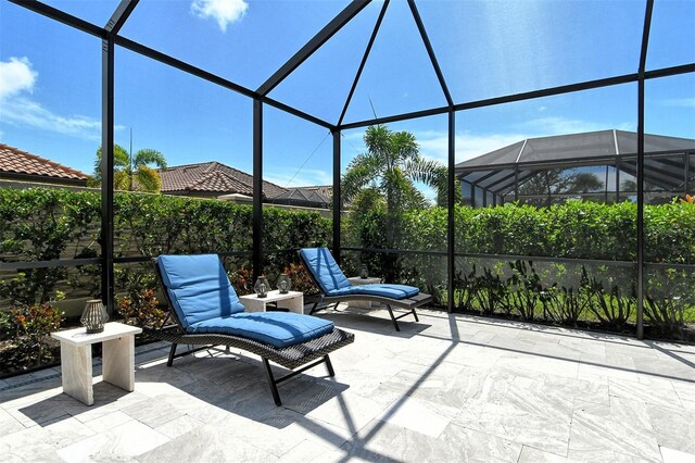 view of patio / terrace with a lanai