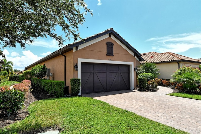 garage with a yard