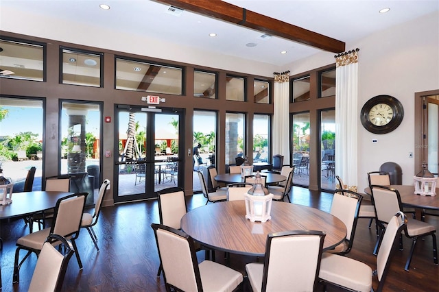 dining area featuring a wealth of natural light, beamed ceiling, french doors, and dark hardwood / wood-style flooring