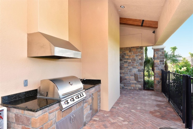 view of patio with exterior kitchen and grilling area