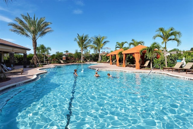 view of swimming pool with a gazebo and a patio area