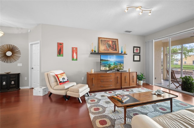 living room with dark hardwood / wood-style floors