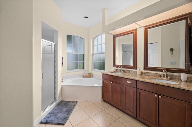 bathroom featuring vanity, plus walk in shower, and tile patterned floors