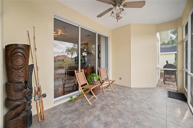 sunroom / solarium with ceiling fan