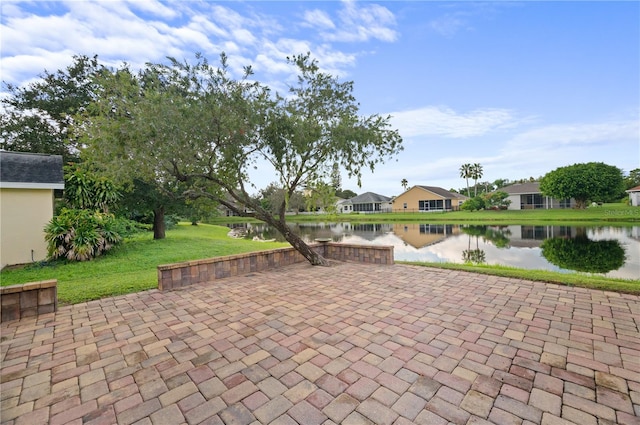 view of patio featuring a water view