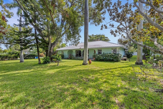 exterior space featuring a front lawn