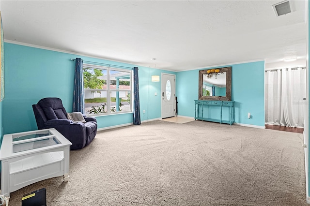 sitting room featuring carpet flooring and crown molding