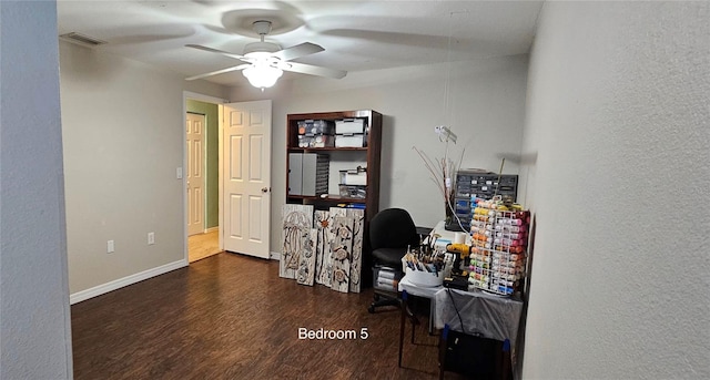 home office featuring ceiling fan and dark hardwood / wood-style flooring