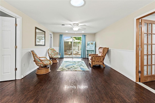 living area featuring ceiling fan and hardwood / wood-style flooring