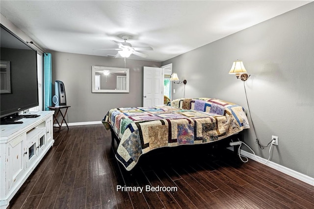 bedroom with multiple windows, dark hardwood / wood-style flooring, and ceiling fan