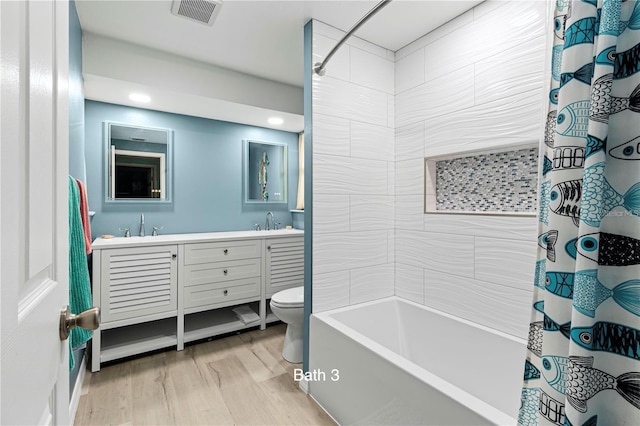 full bathroom featuring vanity, shower / tub combo with curtain, toilet, and hardwood / wood-style flooring